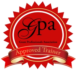 Grant Professionals Association Approved Trainer logo: Red circular seal with GPA in black text at the center and a red folded ribbon with Approved Trainer across the bottom.